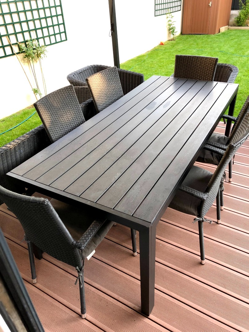 Outdoor table (black) and 6 outdoor chairs (black rattan with grey