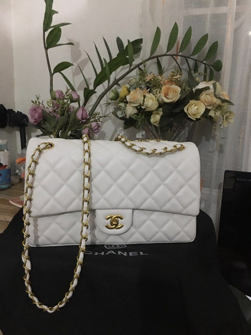 Chanel Caviar White Double Flap (Category: Luxury Bags & Wallets) located in General Trias. Submitted by braveheart.trends (Listing ID 1201086693, Image 1). Description: -Japan Preloved Chanel Caviar White Double Flap -Like New -Brass Gold Hardwares -Caviar Leather -roomy/spacious Chanel size purse -11.7” x 7.6” x 3.9” (30cm x 19.5cm x 10cm) -High Quality Guaranteed.