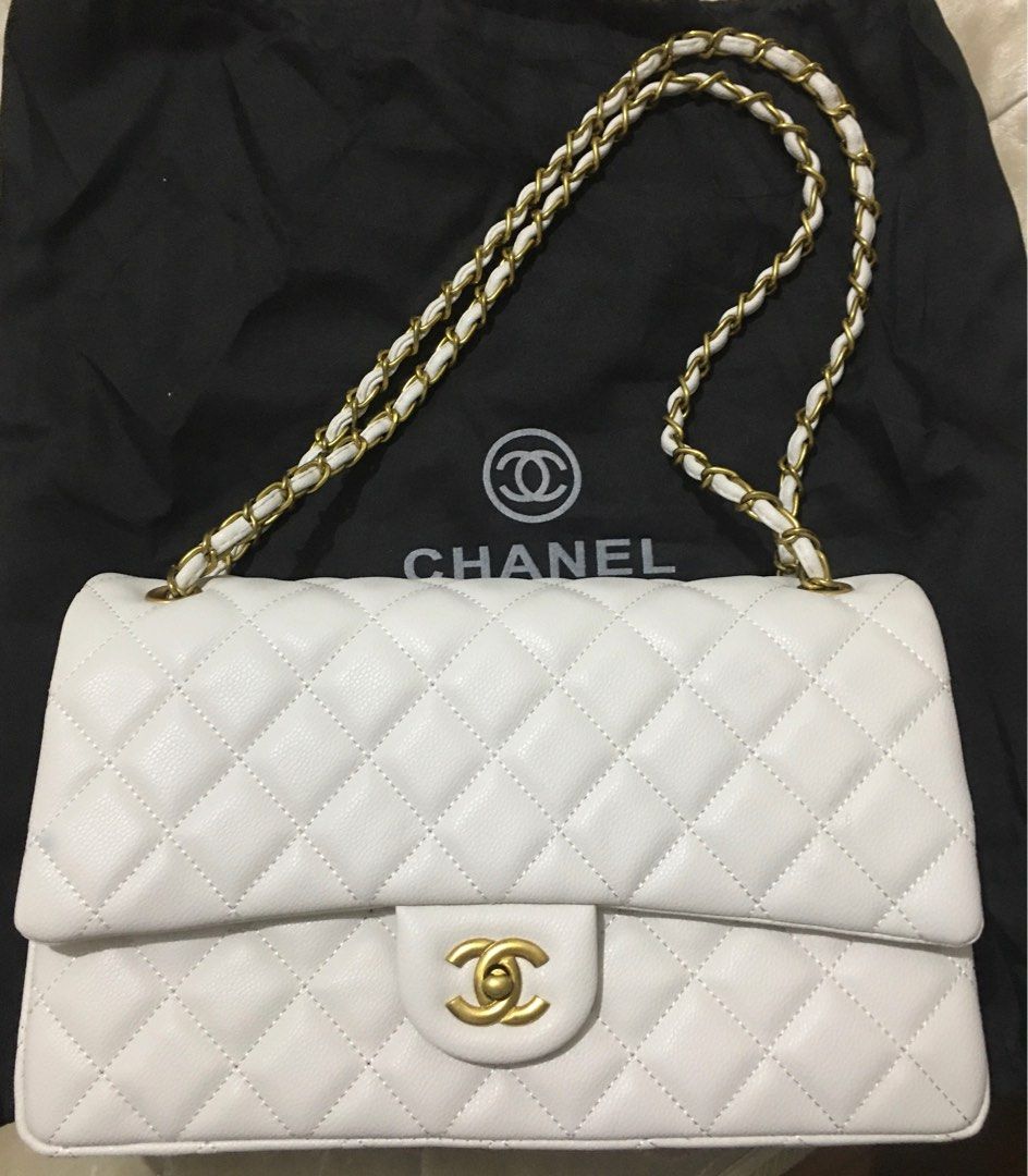 Chanel Caviar White Double Flap (Category: Luxury Bags & Wallets) located in General Trias. Submitted by braveheart.trends (Listing ID 1201086693, Image 2). Description: -Japan Preloved Chanel Caviar White Double Flap -Like New -Brass Gold Hardwares -Caviar Leather -roomy/spacious Chanel size purse -11.7” x 7.6” x 3.9” (30cm x 19.5cm x 10cm) -High Quality Guaranteed.