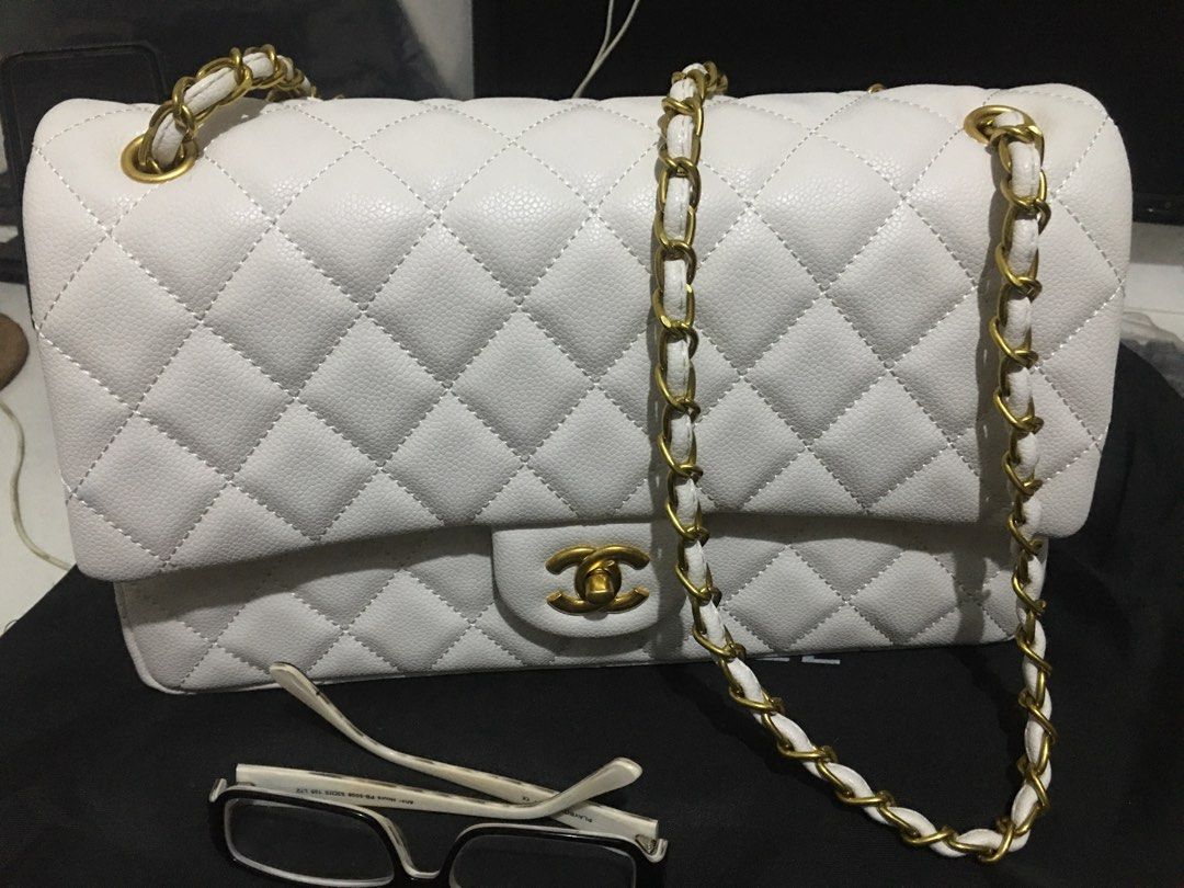 Chanel Caviar White Double Flap (Category: Luxury Bags & Wallets) located in General Trias. Submitted by braveheart.trends (Listing ID 1201086693, Image 3). Description: -Japan Preloved Chanel Caviar White Double Flap -Like New -Brass Gold Hardwares -Caviar Leather -roomy/spacious Chanel size purse -11.7” x 7.6” x 3.9” (30cm x 19.5cm x 10cm) -High Quality Guaranteed.
