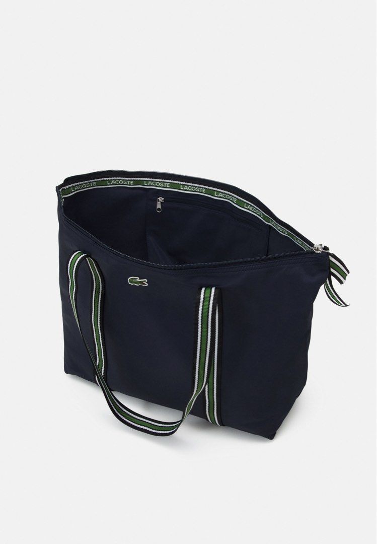 Lacoste (Category: Luxury Bags & Wallets) located in Angeles City. Submitted by psumbillo (Listing ID 1201105635, Image 3). Description: Brand New with lacoste white pouch Complete with tag with Paperbag.