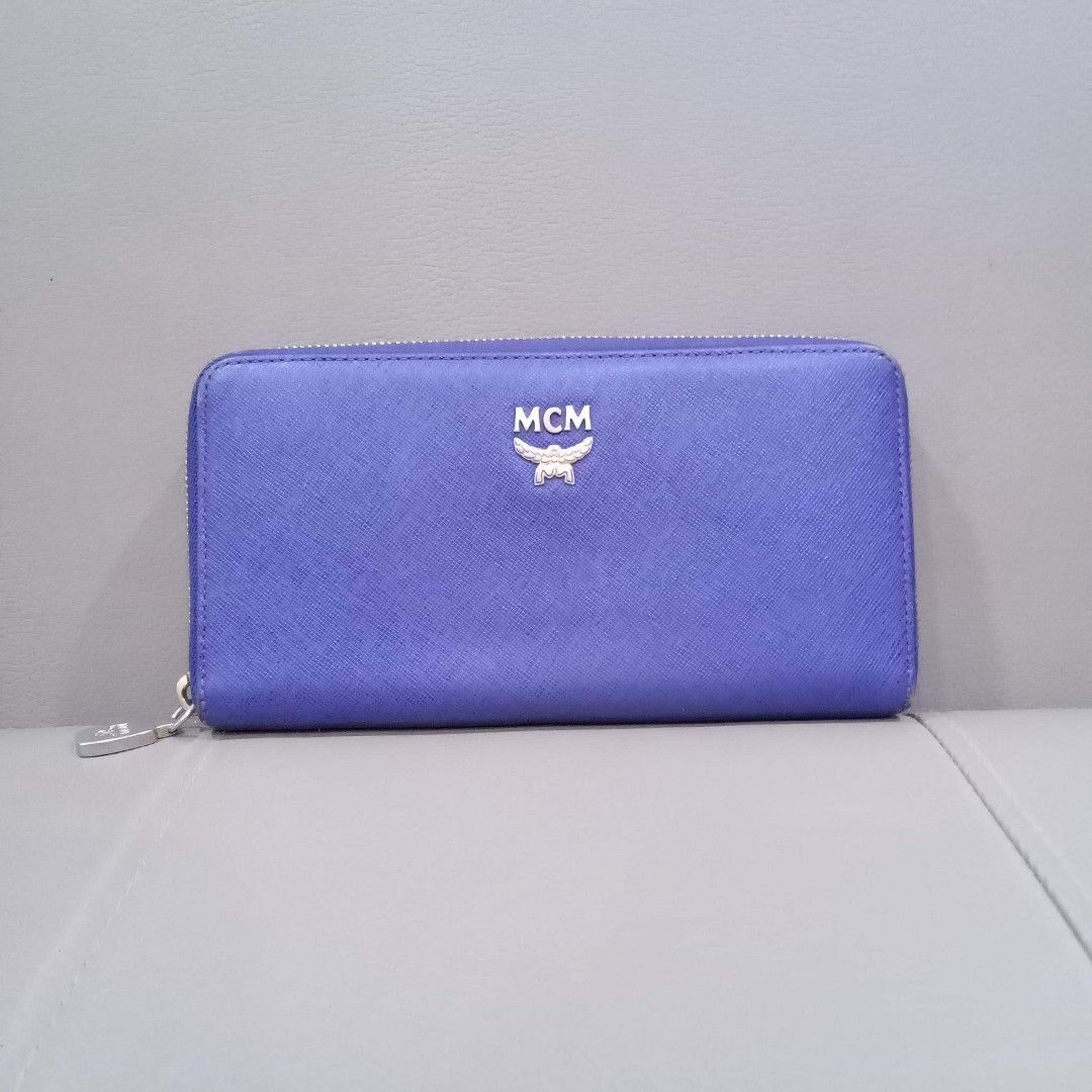 MCM Long Zipper Wallet (Category: Luxury Bags & Wallets) located in Taguig. Submitted by esa.agustin (Listing ID 1201148572, Image 1). Description: Original MCM purple saffiano leather long zipper wallet. Made in Korea..