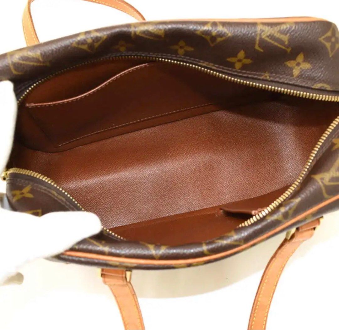 Cite cloth handbag Louis Vuitton Brown in Cloth - 17757085