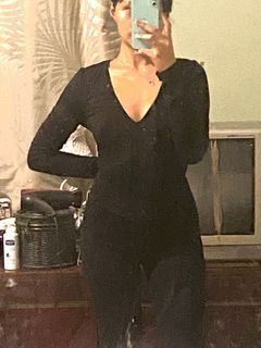 Lady in black long sleeve jumpsuit