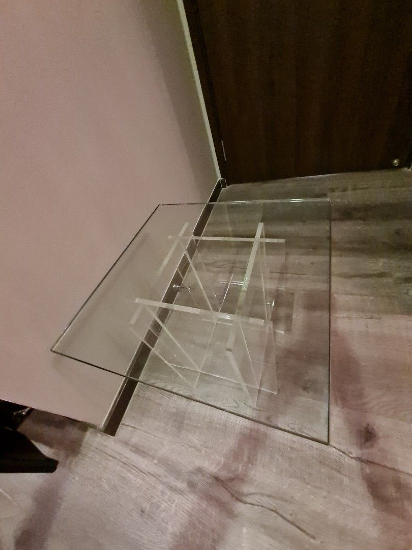 Side table (Category: Other Home Furniture) located in Singapore. Submitted by ziparound97 (Listing ID 1201549734, Image 1). Description: Glass table top 46 x 46cm. Acrylic base 30 x 30 x 40.5cm height. Timeless beauty..