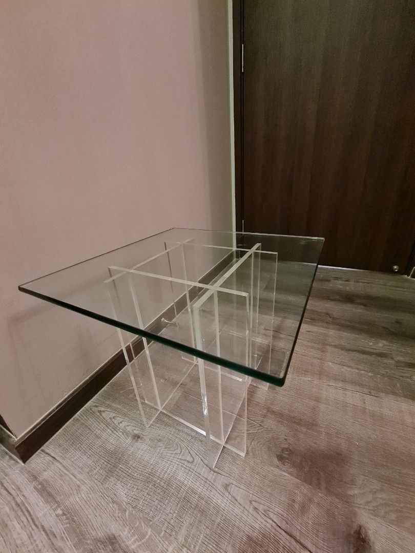Side table (Category: Other Home Furniture) located in Singapore. Submitted by ziparound97 (Listing ID 1201549734, Image 2). Description: Glass table top 46 x 46cm. Acrylic base 30 x 30 x 40.5cm height. Timeless beauty..