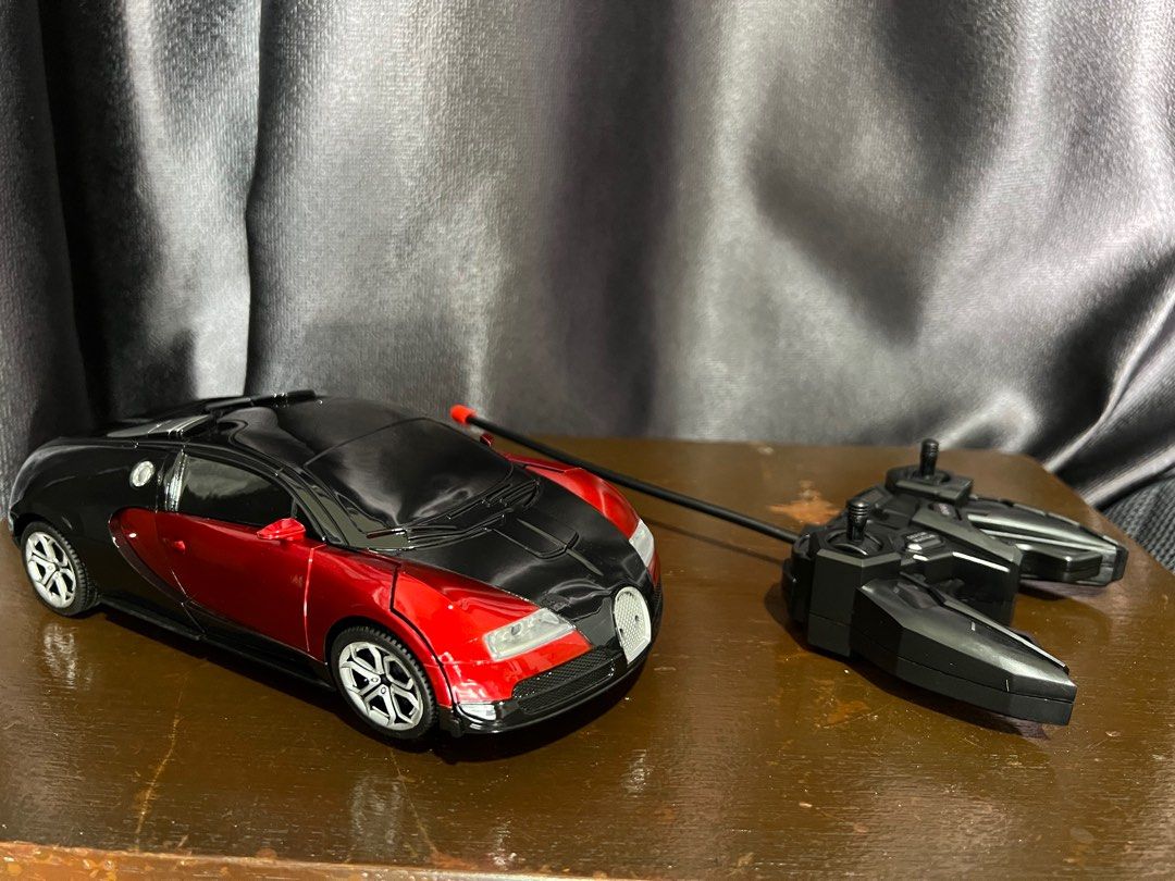 Transformable Remote Control Car (Category: Remote Control Toys) located in Singapore. Submitted by beanie76 (Listing ID 1201466132, Image 1). Description: It brand new as I only removed it from the boxes to take photos. Makes a nice present for kids above 6 yrs😊.