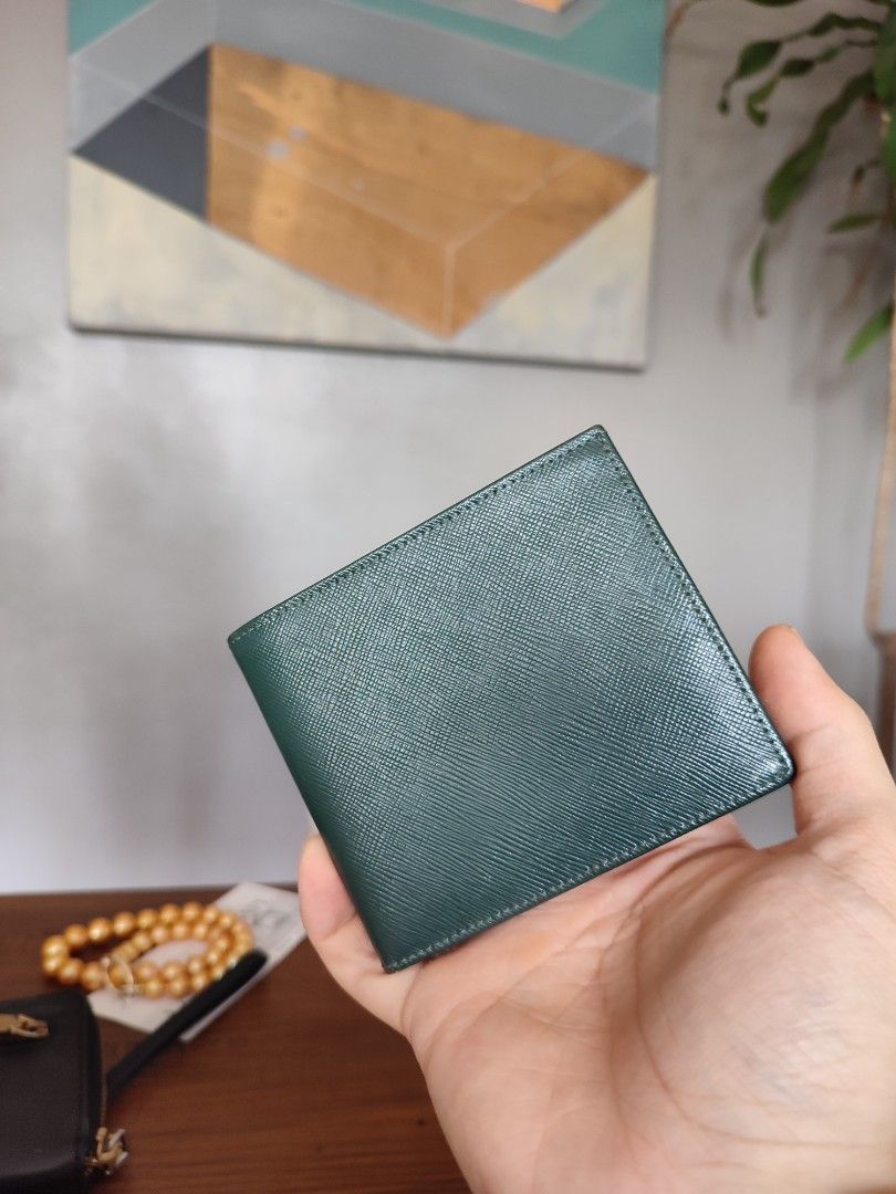 Bally saffiano leather deep green bifold wallet (Category: Wallets & Card Holders) located in Mandaluyong City. Submitted by ice.declutter (Listing ID 1201683951, Image 1). Description: Bally deep green saffiano leather bifold wallet for sale slightly used condition selling low pm me for any concerns :).