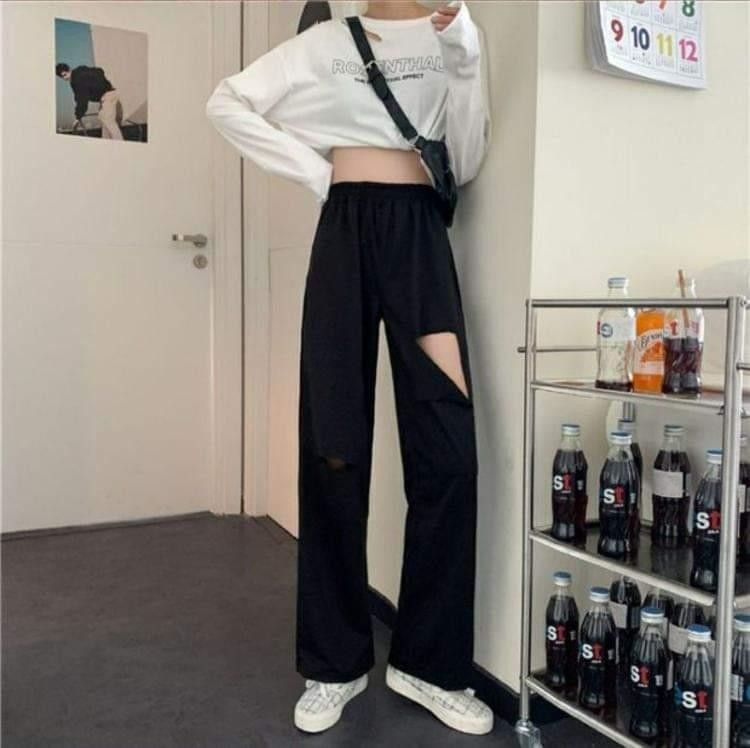 Ripped black sweatpants on sale