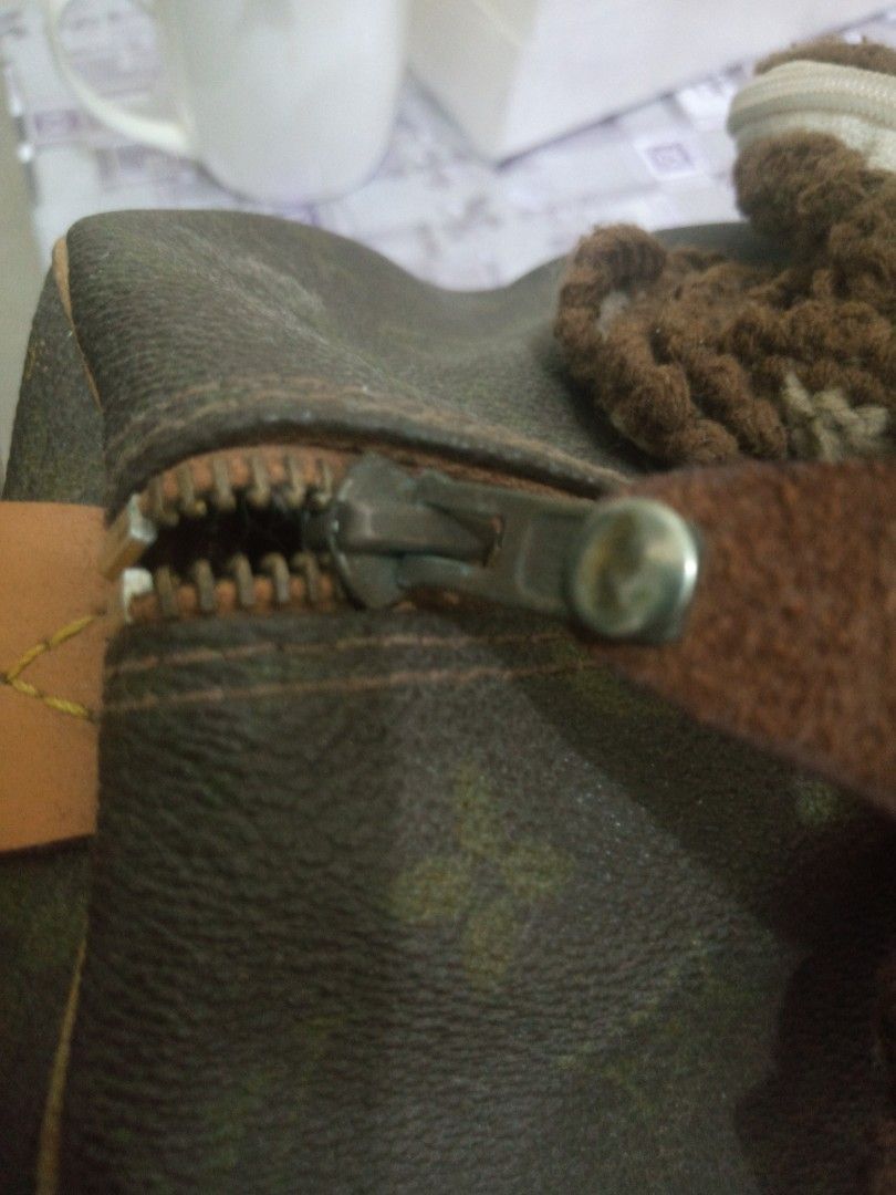 LV with Eclair Zipper, 35 inche (Category: Luxury Bags & Wallets) located in Quezon City. Submitted by bebenico (Listing ID 1201677116, Image 2). Description: already repaired by a bag spa which I have paid around 2k, still beautiful and very much presentable it has an eclair zipper, one indication that this is an LV vintage bag price comes with crochet handle that i spent around 1k rfs: decluttering.