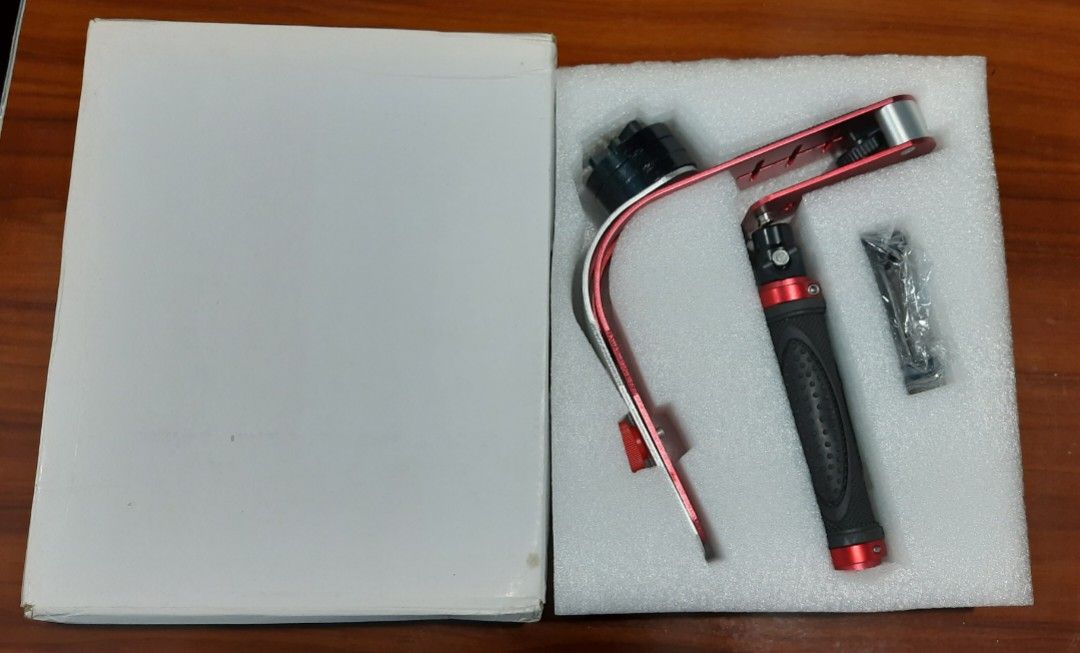 Mini Handheld Steadycam Camera Stabilizer Handle Grip (Category: Gimbals & Stabilizers ) located in Baliuag. Submitted by mostlyaboutnintendo (Listing ID 1201811787, Image 2). Description: The Steady Video Stabilizer is designed for use with camcorders, DSLRs, HD DSLRs, etc. It provides excellent stability and reduces camera vibration during video recording, assuring high-quality, and clear videos. Its aluminum alloy construction provides and sol