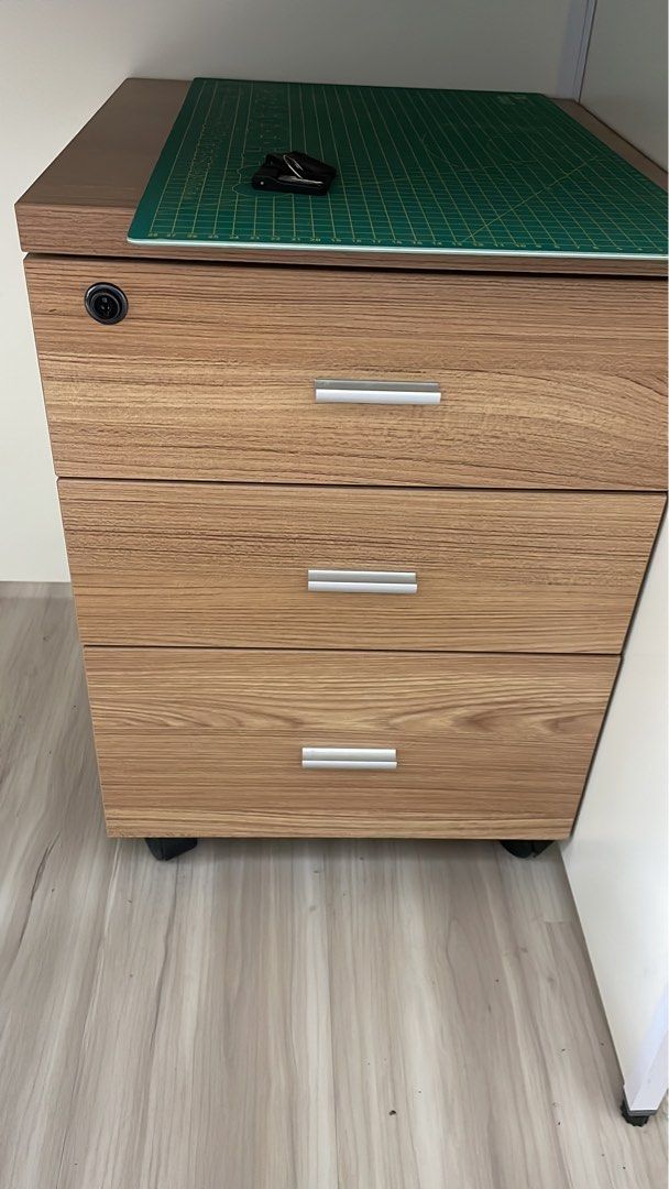Office table for two with 3 drawers cabinet (Category: Tables & Sets) located in Singapore. Submitted by Realseller (Listing ID 1193647836, Image 2). Description: Original price: $500 This is for two people and is quite good to use for office and other stuffs. 2pcs, each pc dimension L120 * W 120 * H110 cm.