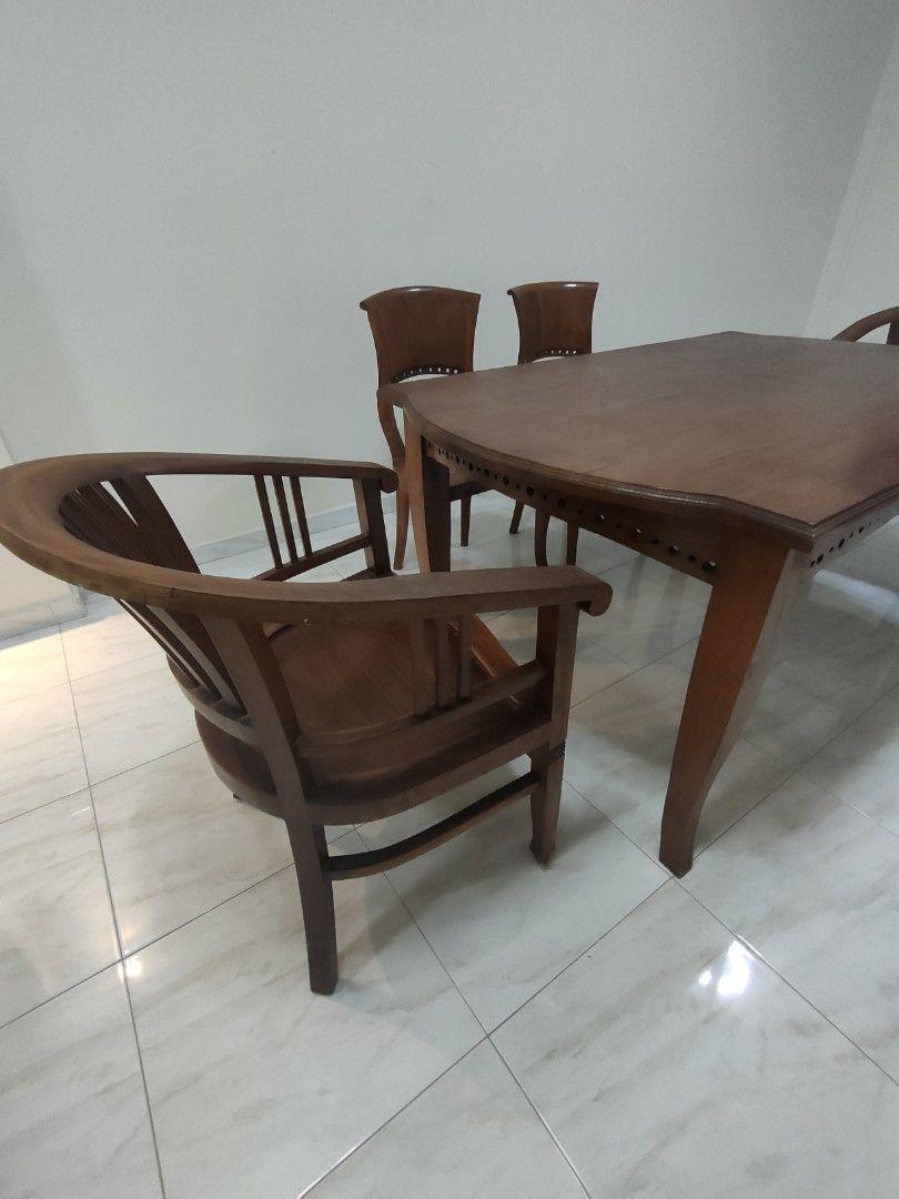 Solid wood dining table set (Category: Tables & Sets) located in Singapore. Submitted by chuasc4000 (Listing ID 1201769754, Image 2). Description: set of 4 chairs and 1 table dimensions: 1.6m length, 1m width, 77cm height.