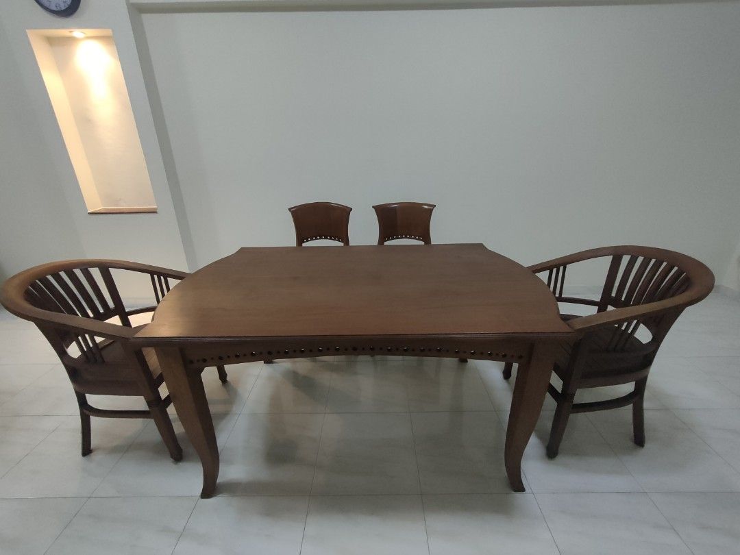 Solid wood dining table set (Category: Tables & Sets) located in Singapore. Submitted by chuasc4000 (Listing ID 1201769754, Image 1). Description: set of 4 chairs and 1 table dimensions: 1.6m length, 1m width, 77cm height.