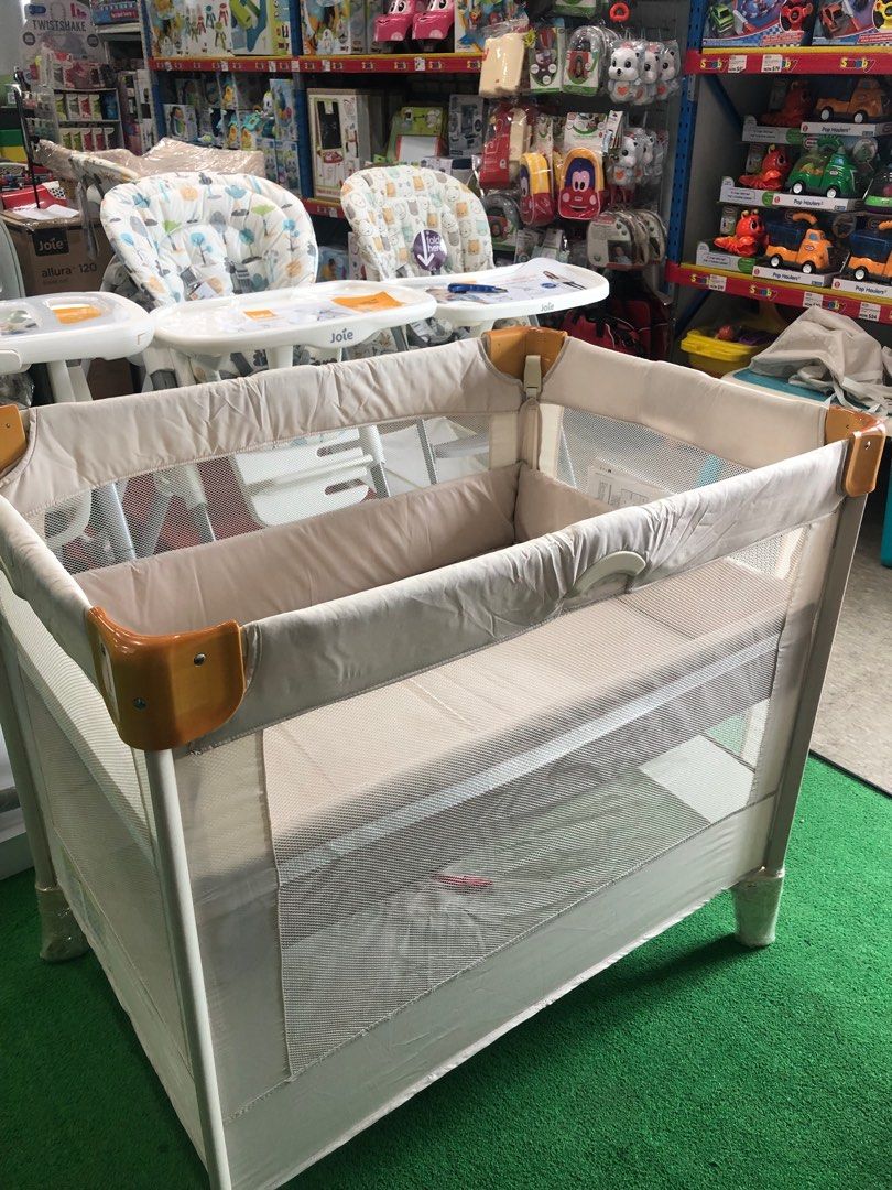 Aprica travel on sale crib