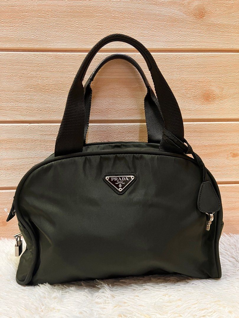 Authentic Prada Bowlers Bag (Category: Luxury Bags & Wallets) located in Cagayan de Oro. Submitted by riggstuffs (Listing ID 1201981528, Image 1). Description: Guaranteed Authentic Prada Bowlers Bag Made in Italy With white code Exterior is made of nylon material complimented with leather trimming Interior is clean and spacious With lock and key DISCLAIMER: Riggstuffs is not affiliated or associated with the brand posted. All trademarks and copyr