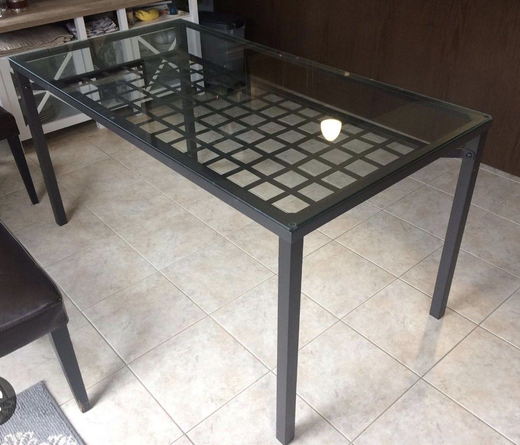 Dining Table (Category: Tables & Sets) located in Singapore. Submitted by kpwk69 (Listing ID 1202028280, Image 1). Description: Selling just the table. Solid Metal frame, Glass top with a secondary deck, great to place napkin, coaster etc. .