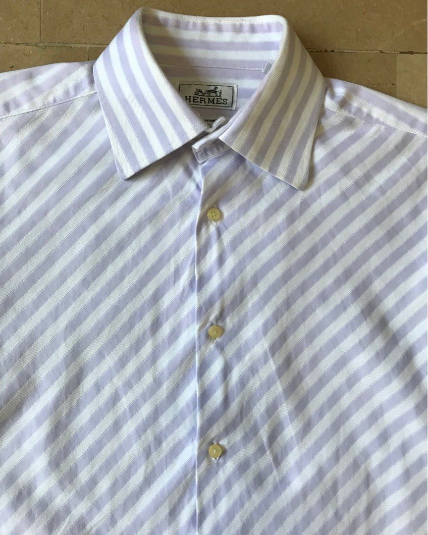 Hermes bias shirt (Category: Luxury Apparel) located in Quezon City. Submitted by raccoonfur (Listing ID 1201986775, Image 3). Description: Special mid-weight weave cotton poplin shirt. Subtle texture to go with its striped pattern. French cuffs with Chinoiserie cufflinks. And an interesting bias cut front panel. Very good condition. Pit to pit 22” Length 29.5” Inseam 21” Shoulders 18.5” .