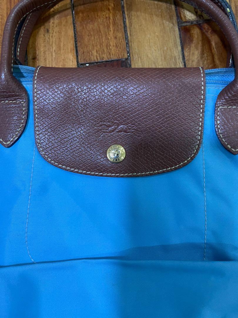 Long Champ Medium Short Handle (Category: Luxury Bags & Wallets) located in Quezon City. Submitted by ellabelles (Listing ID 1141050368, Image 2). Description: Long Champ Medium Short handle Needs cleaning but overall okay.