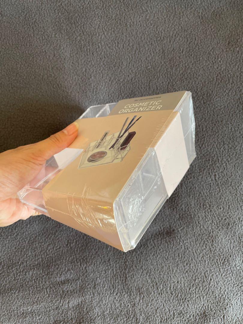 Cosmetic Organizer (Category: Accessory Holder, Box & Organizers) located in Makati City. Submitted by argin (Listing ID 1142906225, Image 2). Description: Made of acrylic material Has 8 compartments for various makeup items Brand new and sealed RFS: Decluttering.
