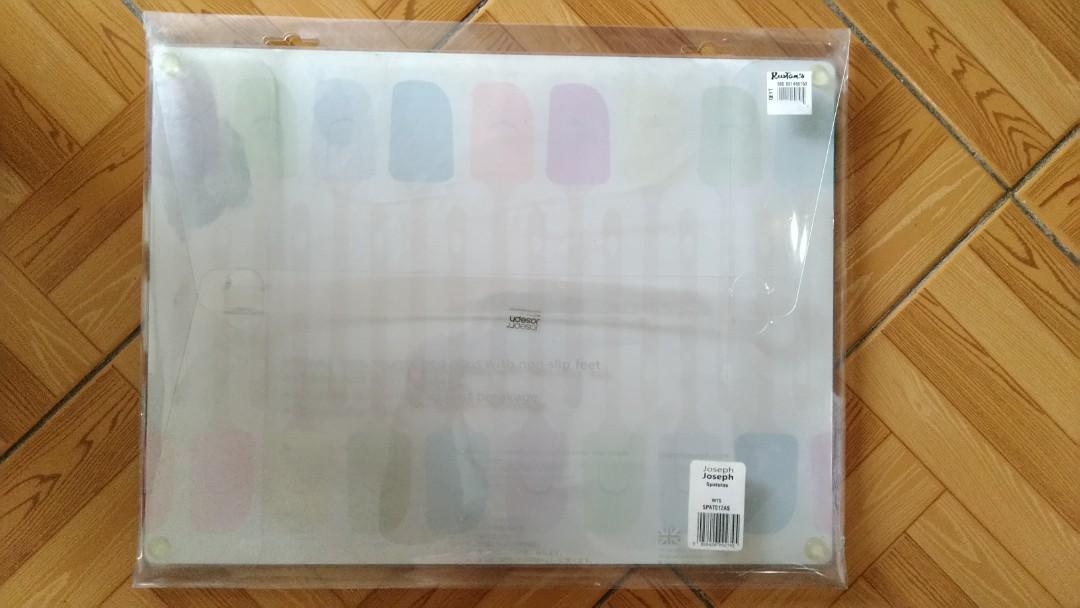 Like New Joseph Joseph Glass Worktop Saver (Category: Other Kitchenware & Tableware) located in Quezon City. Submitted by jetsetterslair (Listing ID 1143066140, Image 2). Description: Used once or twice only. Made from toughened textured glass and with non-slip rubber feet, cute spatula print, these multi-function boards provide a hygienic, odour and stain-resistant work surface for all types of food preparation and presentation. In addition, the