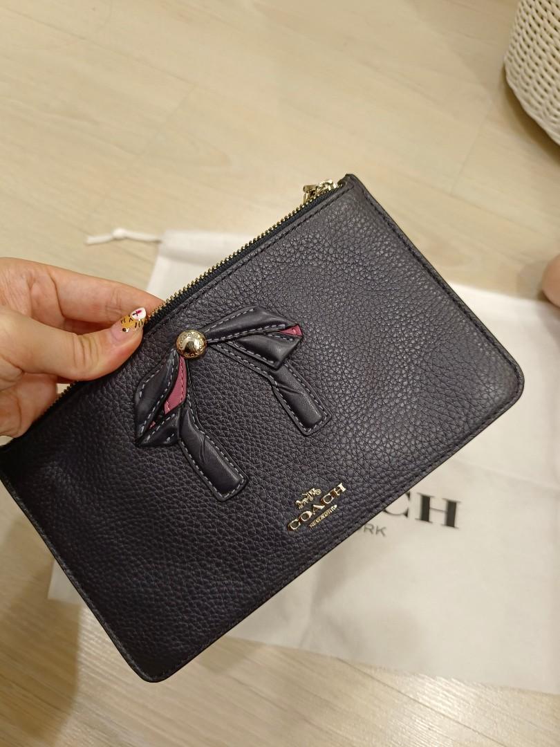 Coach medium size wristlet Luxury Bags Wallets on Carousell
