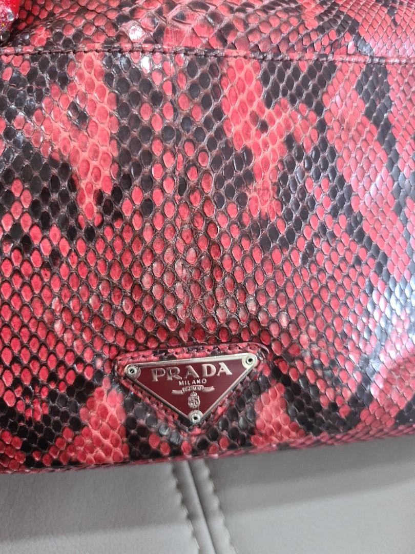 Prada Python clutch (Category: Bags & Wallets) located in Singapore. Submitted by bagslover (Listing ID 1143308502, Image 3). Description: Prada Cherry Python clutch bag. Limited ,Cream leather lining. 31x15x8cm with dust bag..