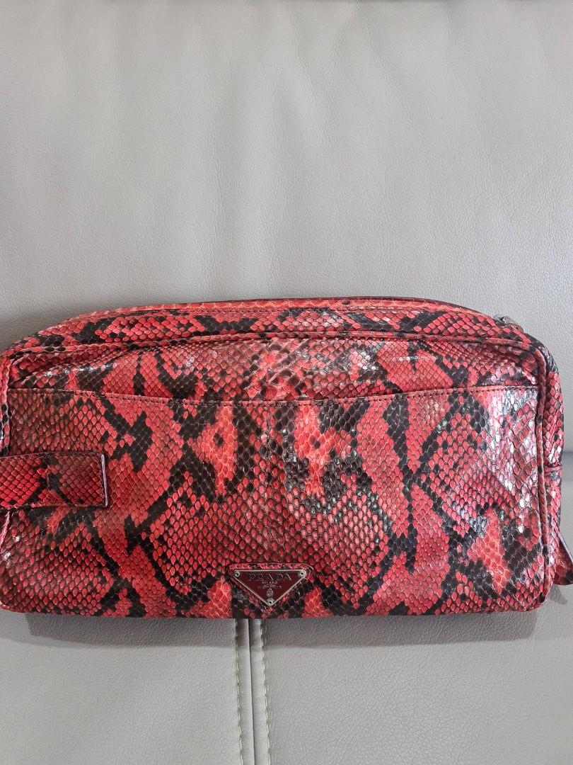 Prada Python clutch (Category: Bags & Wallets) located in Singapore. Submitted by bagslover (Listing ID 1143308502, Image 1). Description: Prada Cherry Python clutch bag. Limited ,Cream leather lining. 31x15x8cm with dust bag..
