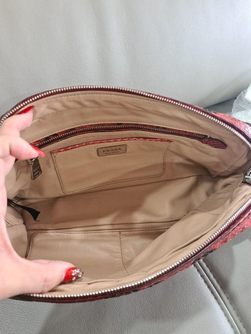 Prada Python clutch (Category: Bags & Wallets) located in Singapore. Submitted by bagslover (Listing ID 1143308502, Image 2). Description: Prada Cherry Python clutch bag. Limited ,Cream leather lining. 31x15x8cm with dust bag..