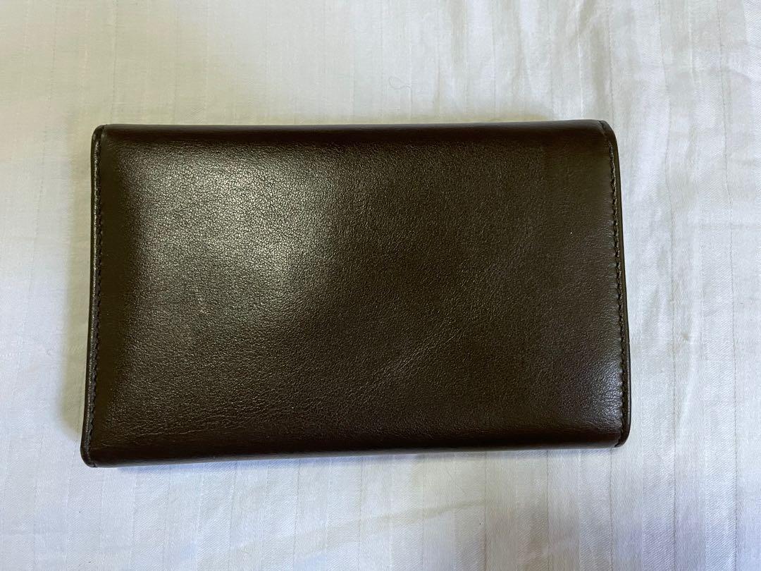 Salvatore Ferragamo Gancini Wallet (Category: Luxury Bags & Wallets) located in Cainta. Submitted by arideclutter (Listing ID 1143399902, Image 2). Description: Authentic Salvatore Ferragamo Wallet Unused, just kept in the box Color: Cacao / Dark Brown Calf Leather -- smells really good 😝 Has hairline scratches on front lock but barely noticeable Store price is Php 27,500.