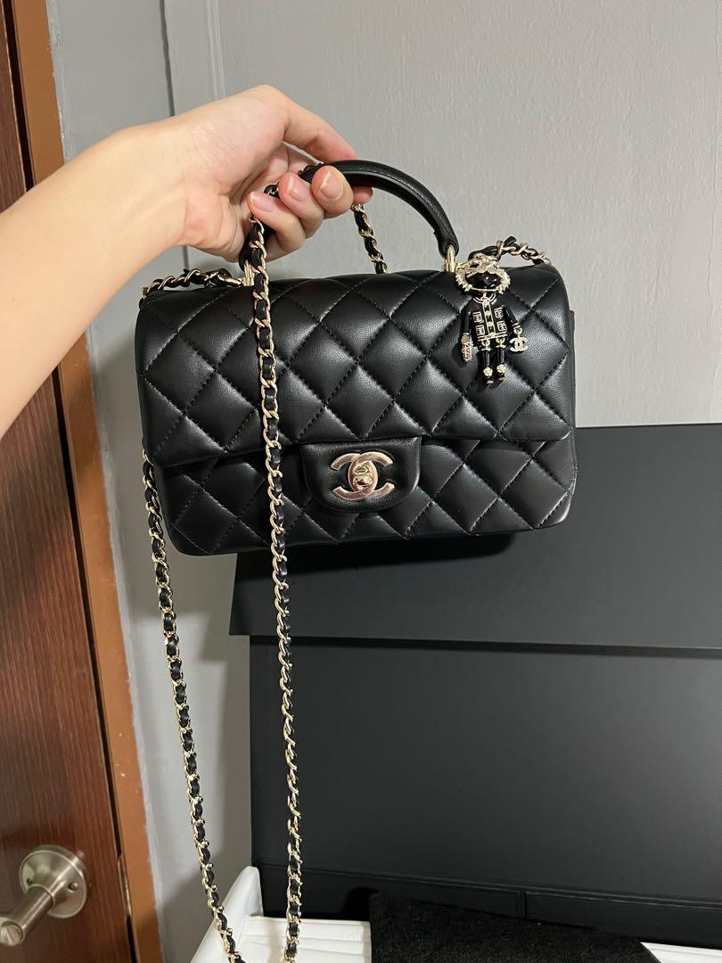 CHANEL Mini flap bag with top handle w coco chanel charm