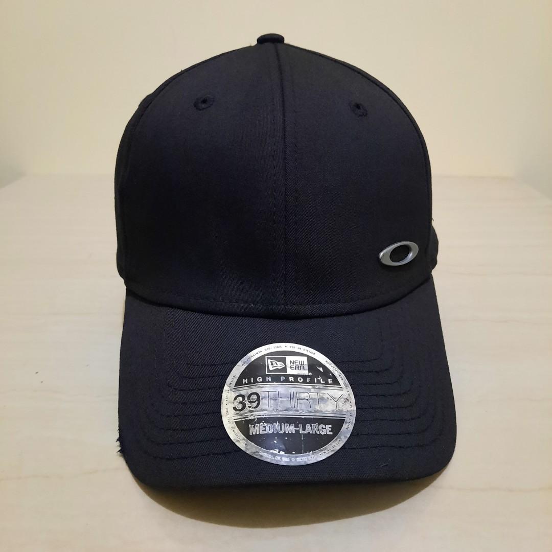 TOPI NEW ERA OAKLEY SIZE M-L BENANG 