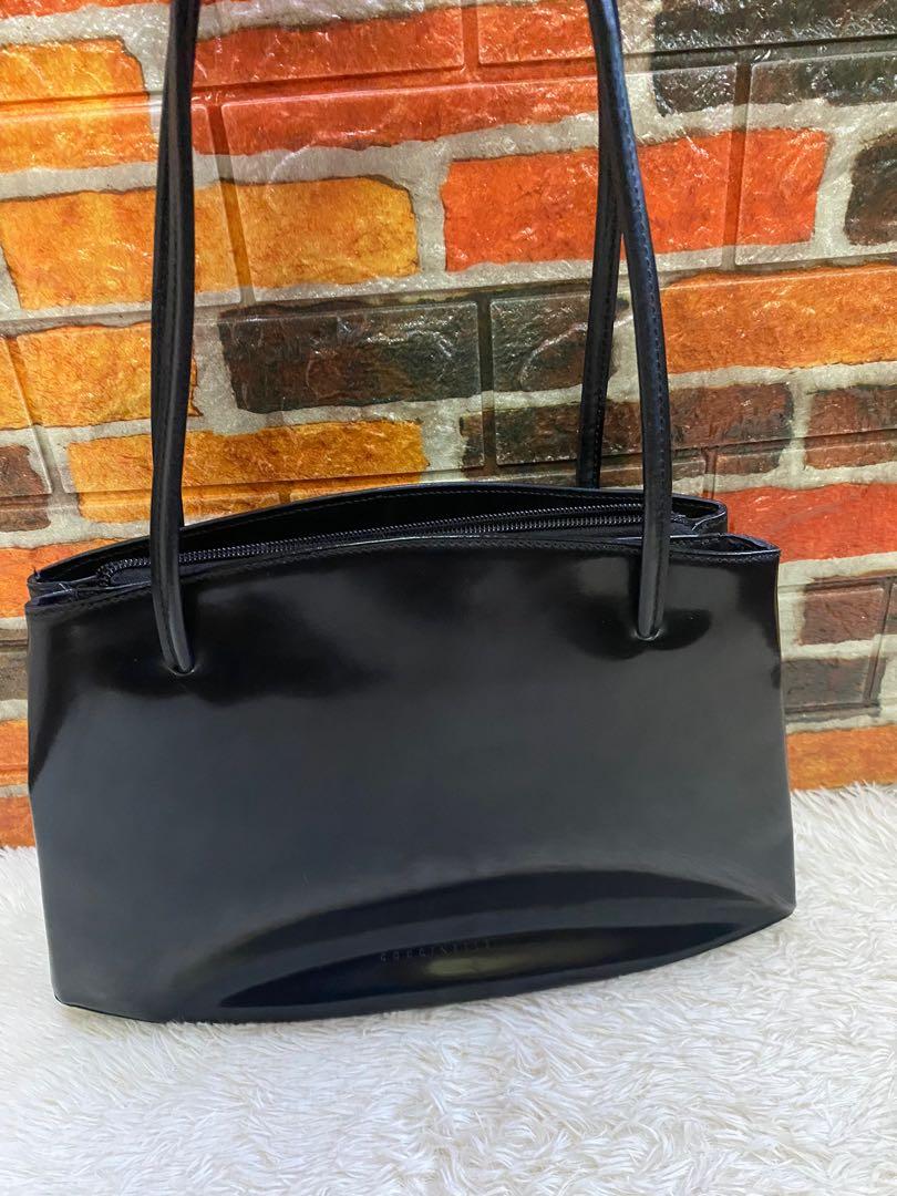 Authentic Coccinelle Black Patent Tote Bag (Category: Luxury Bags & Wallets) located in Cagayan de Oro. Submitted by riggstuffs (Listing ID 1144068640, Image 2). Description: Guaranteed Authentic Coccinelle Patent Leather Bag The Exterior has some signs of use, some scuffs at the material, but no flaws at the corners or edges The Interior is in good condition Measurement is H10”x L 13”x W4” No other inclusion DISCLAIMER: Riggstuffs is not affilia