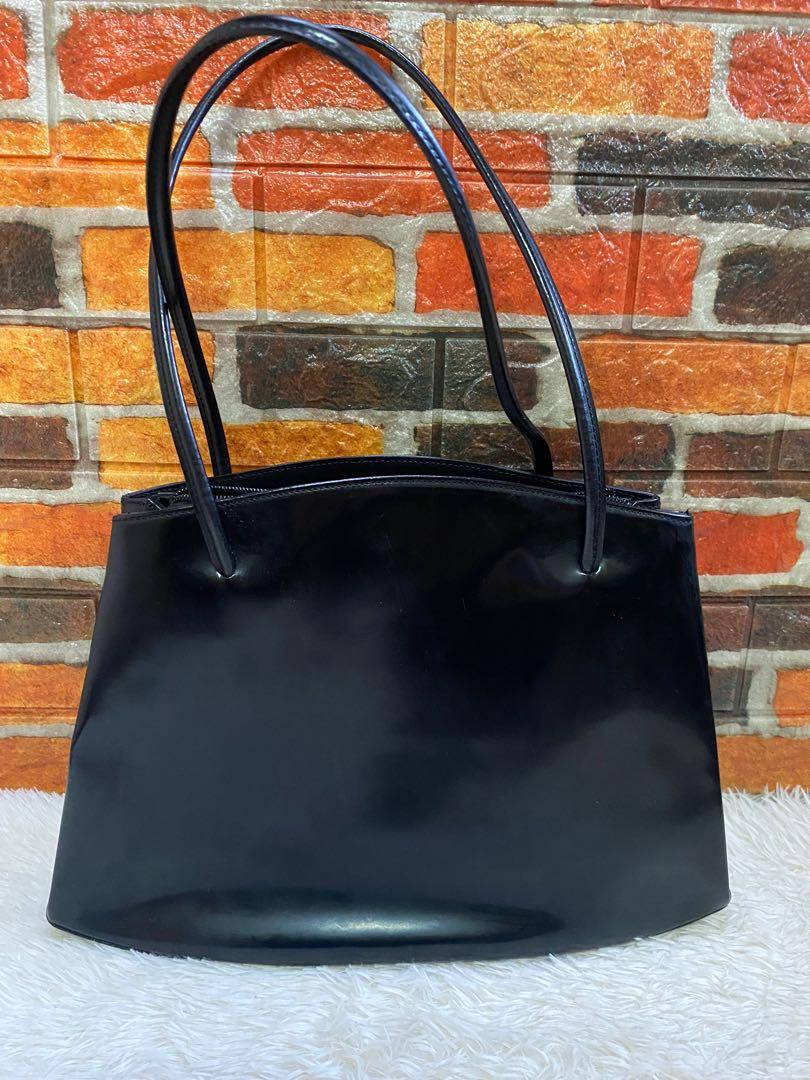 Authentic Coccinelle Black Patent Tote Bag (Category: Luxury Bags & Wallets) located in Cagayan de Oro. Submitted by riggstuffs (Listing ID 1144068640, Image 1). Description: Guaranteed Authentic Coccinelle Patent Leather Bag The Exterior has some signs of use, some scuffs at the material, but no flaws at the corners or edges The Interior is in good condition Measurement is H10”x L 13”x W4” No other inclusion DISCLAIMER: Riggstuffs is not affilia