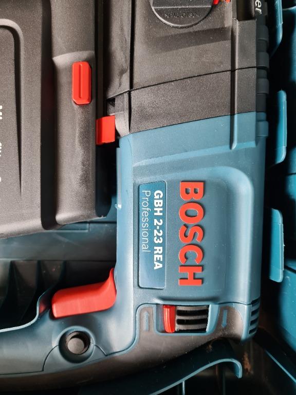 Bosch GBH 2 23 REA Professional Hammer Drill with vacuum attached