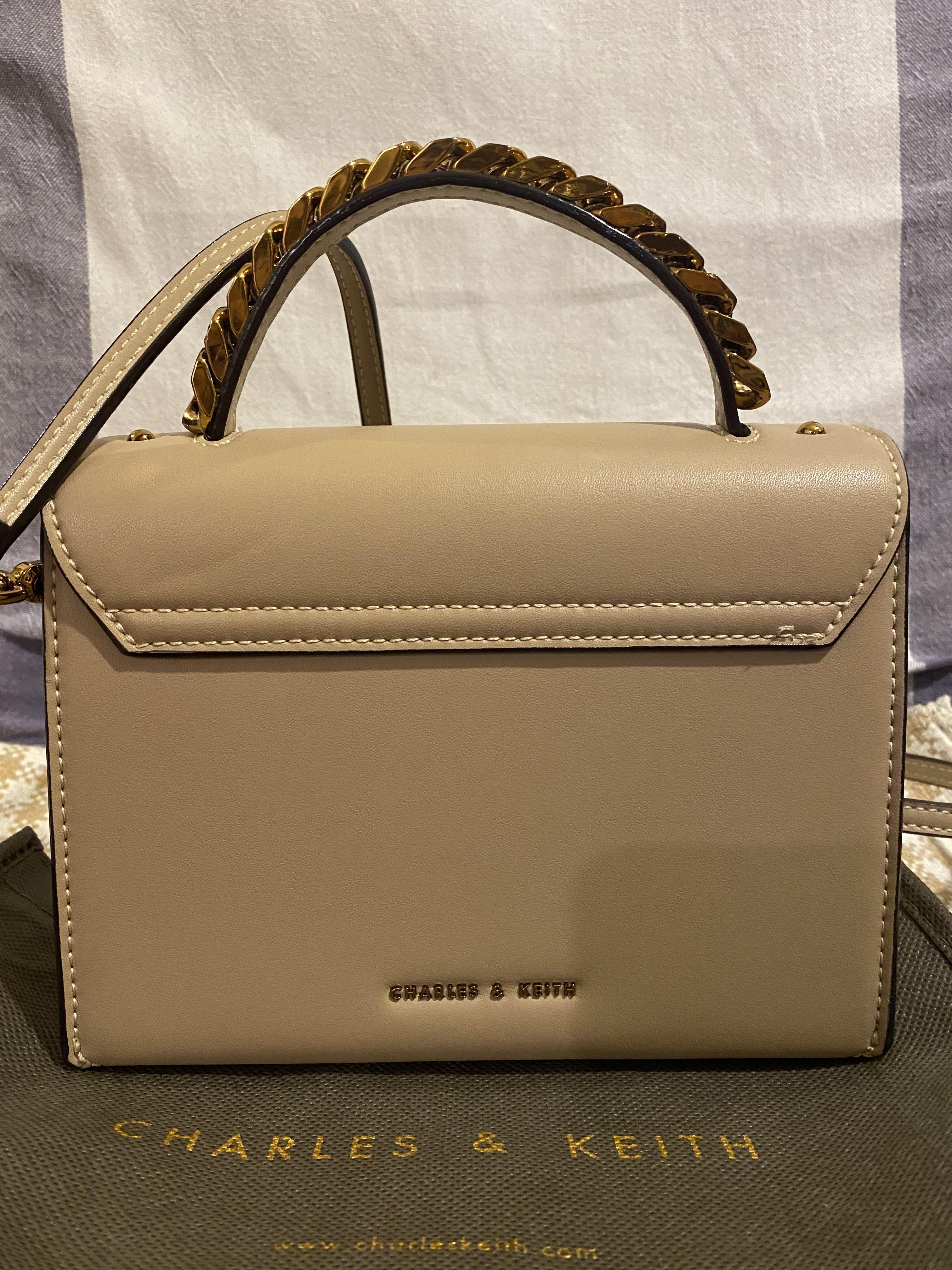 Chunky metal top handle bow flap bag store