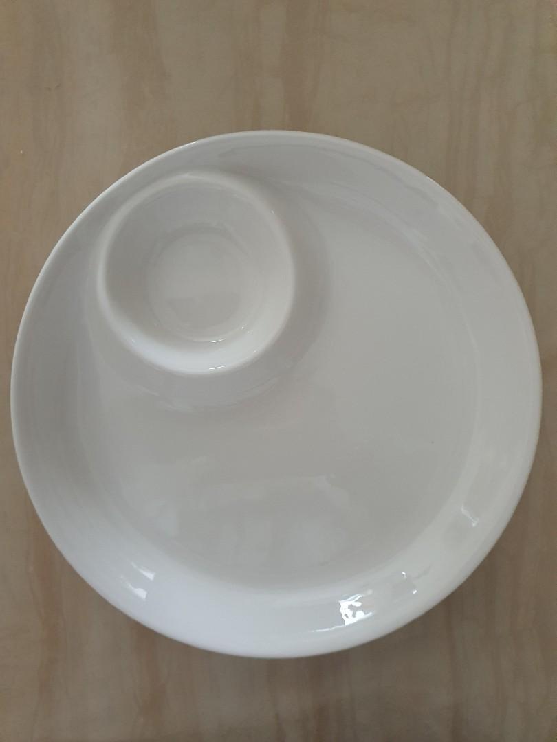 Two Serving plates (Category: Dinnerware & Cutlery) located in Singapore. Submitted by mysticjw (Listing ID 1144597889, Image 1). Description: 2 Serving plates @ only $9. More than half price to clear them! As good as new Used only once as i bought new rectangle serving platter. measurement: 24 cm diameter depth: 3 cm ideal to serve food (e.g chicken wings/drumlets; dumplings etc accompanied with sauce!) To self collect at Woodlands.