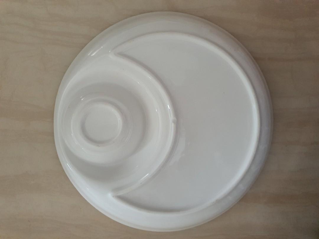 Two Serving plates (Category: Dinnerware & Cutlery) located in Singapore. Submitted by mysticjw (Listing ID 1144597889, Image 2). Description: 2 Serving plates @ only $9. More than half price to clear them! As good as new Used only once as i bought new rectangle serving platter. measurement: 24 cm diameter depth: 3 cm ideal to serve food (e.g chicken wings/drumlets; dumplings etc accompanied with sauce!) To self collect at Woodlands.