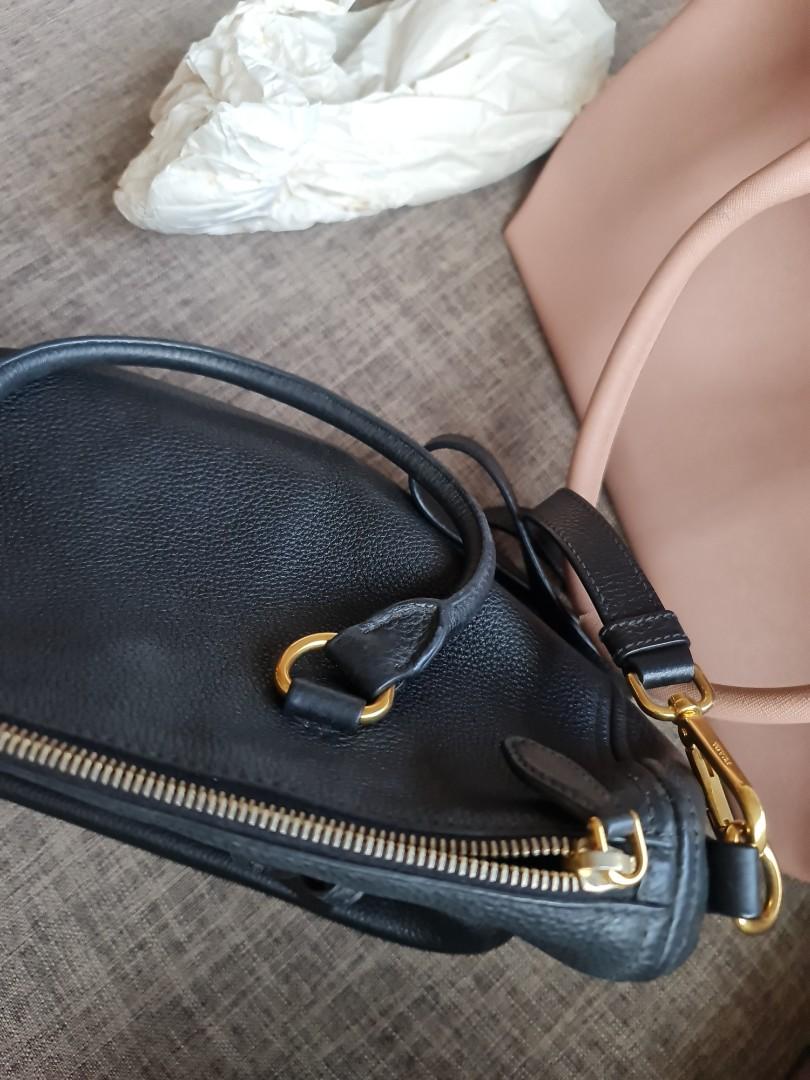 Prade Leather Sling Bag (Category: Luxury Bags & Wallets) located in Pasig City. Submitted by jinkookkart (Listing ID 1141189950, Image 2). Description: bought for ₱48k in Milan, Italy all leather has some scuffs but can be easily repaired by leather stores.