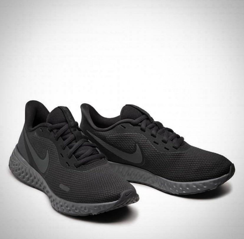 black nike revolution trainers