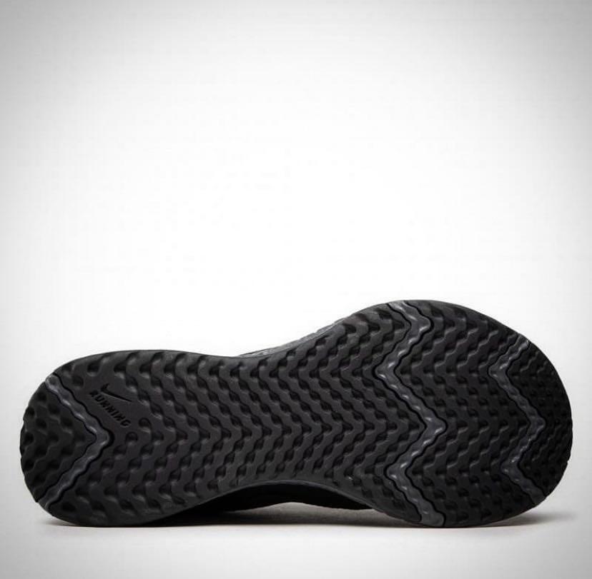 black nike revolution trainers