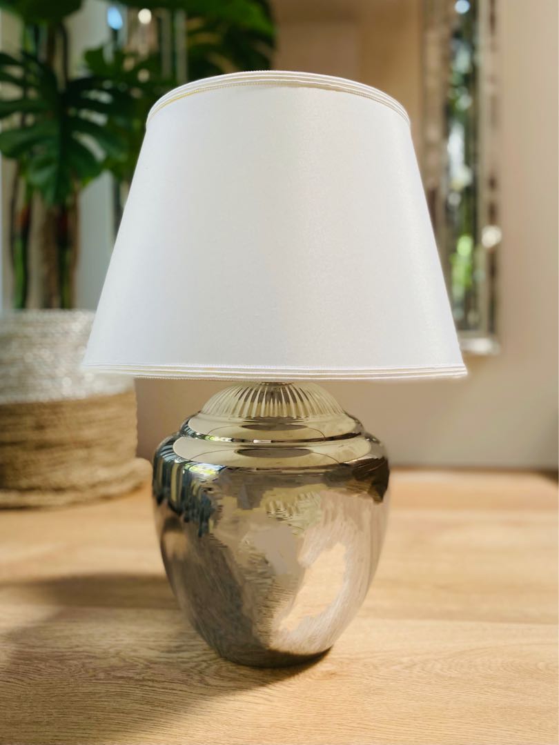 white lamp with silver base