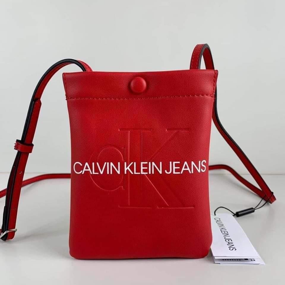 Calvin Klein sling bag in burnt orange color. Gently used
