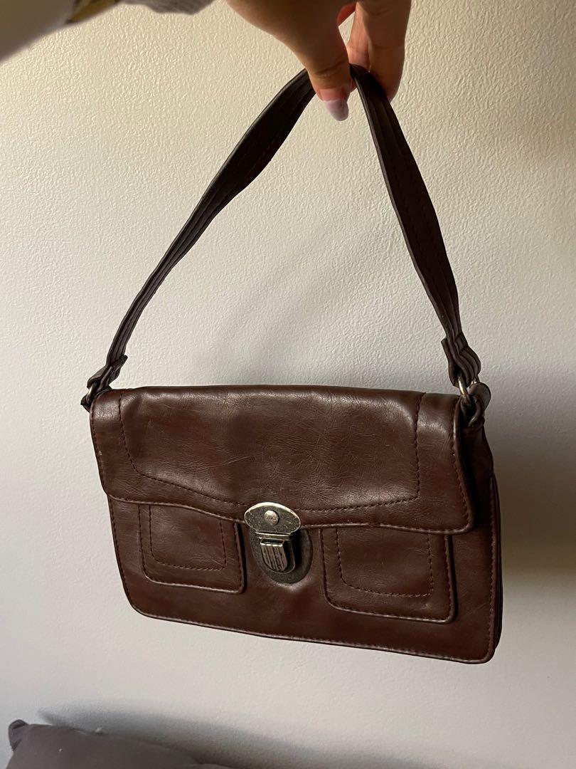 MANGO brown handbag (Category: Luxury Bags & Wallets) located in Taguig. Submitted by jilll18 (Listing ID 1145462423, Image 1). Description: Mango brown handbag, very chic and trendy. Genuine leather ! .