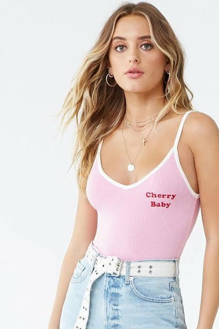 Forever 21 Cherry Baby Bodysuit (Category: Others Tops) located in Manila. Submitted by abthree (Listing ID 1146218126, Image 1). Description: Cute pink ribbed bodysuit with white contrasting straps and edges. With 'cherry baby' stitched on the left side in hot red. Scoop back fit. Has snap closure..