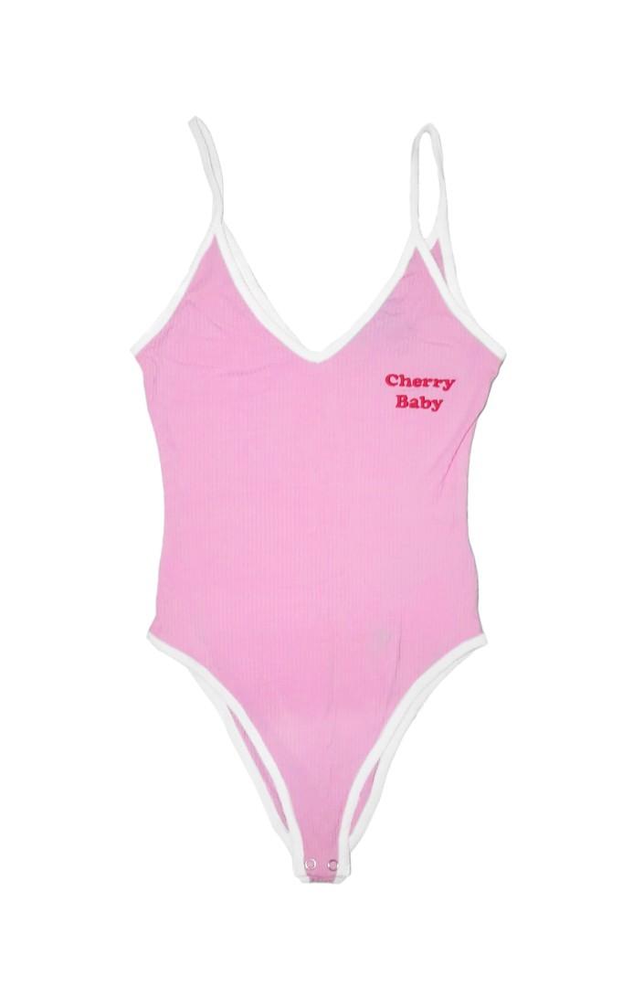 Forever 21 Cherry Baby Bodysuit (Category: Others Tops) located in Manila. Submitted by abthree (Listing ID 1146218126, Image 3). Description: Cute pink ribbed bodysuit with white contrasting straps and edges. With 'cherry baby' stitched on the left side in hot red. Scoop back fit. Has snap closure..