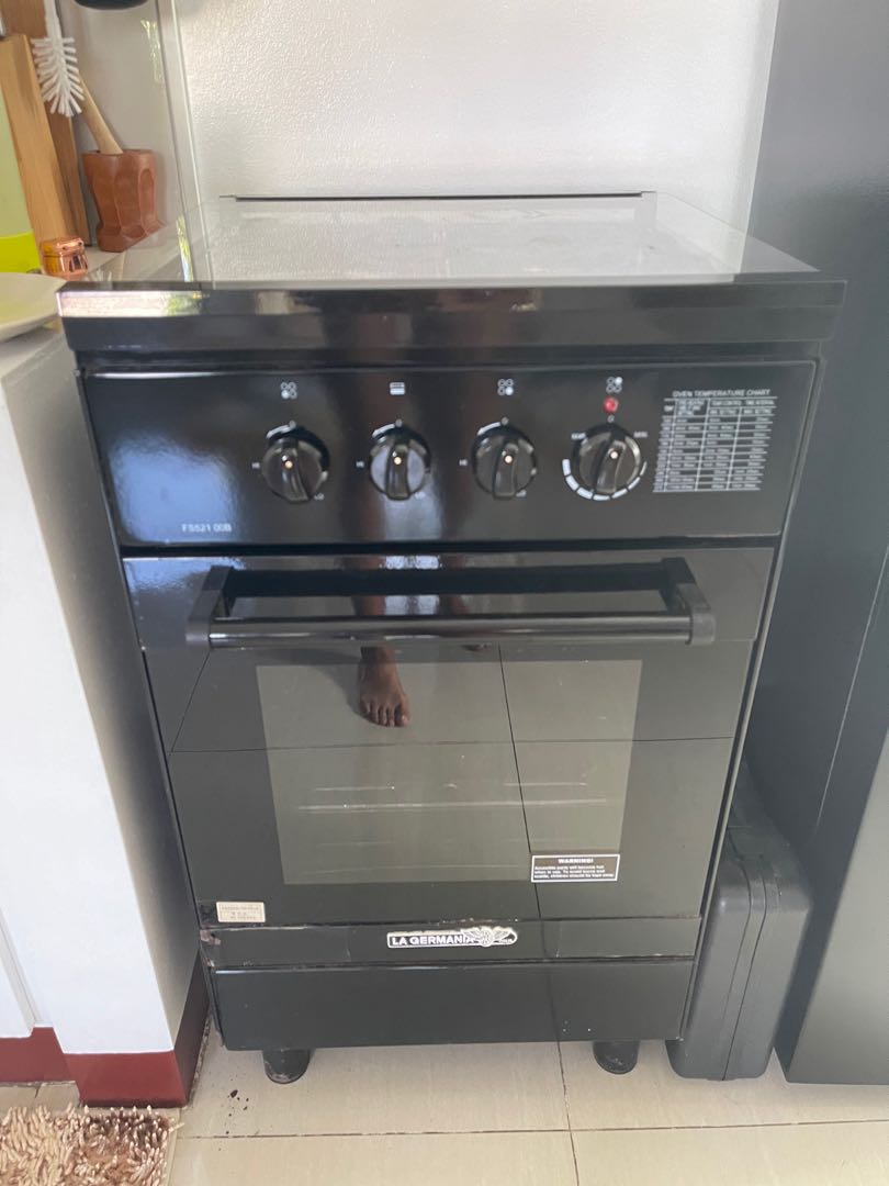 La Germania Gas Range and Manual Over 2 burners 1 electric pad, TV