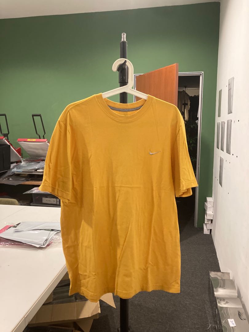 mustard yellow nike shirt