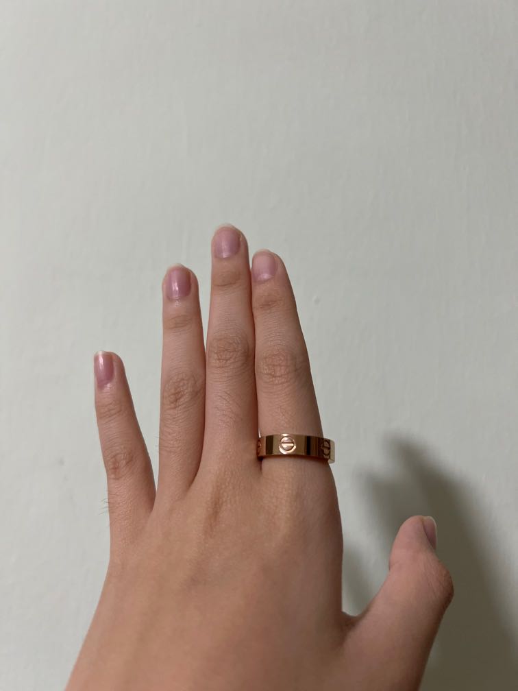 Cartier love ring on finger top