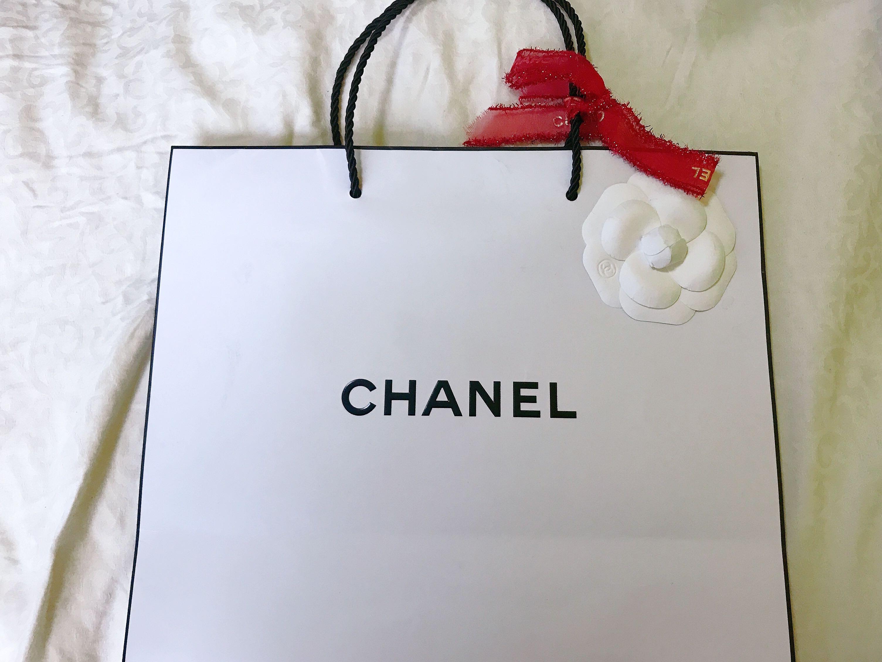 White Chanel Paper Bag with red ribbon